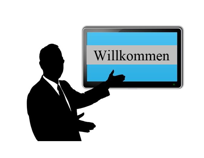 Clipart - Mann der auf ein Schild zeigt.